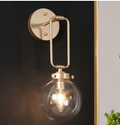 1-Light Antique Gold Globe Wall Sconce with Clear Glass – Naomi Collection